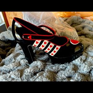 Brand-new, black patent leather With red and white hearts heels